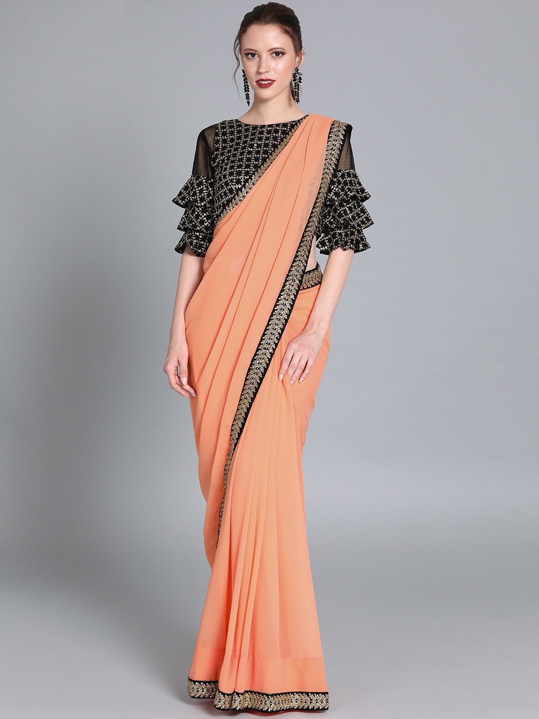 

Ethnovog Peach-Coloured Black Poly Georgette Solid Saree