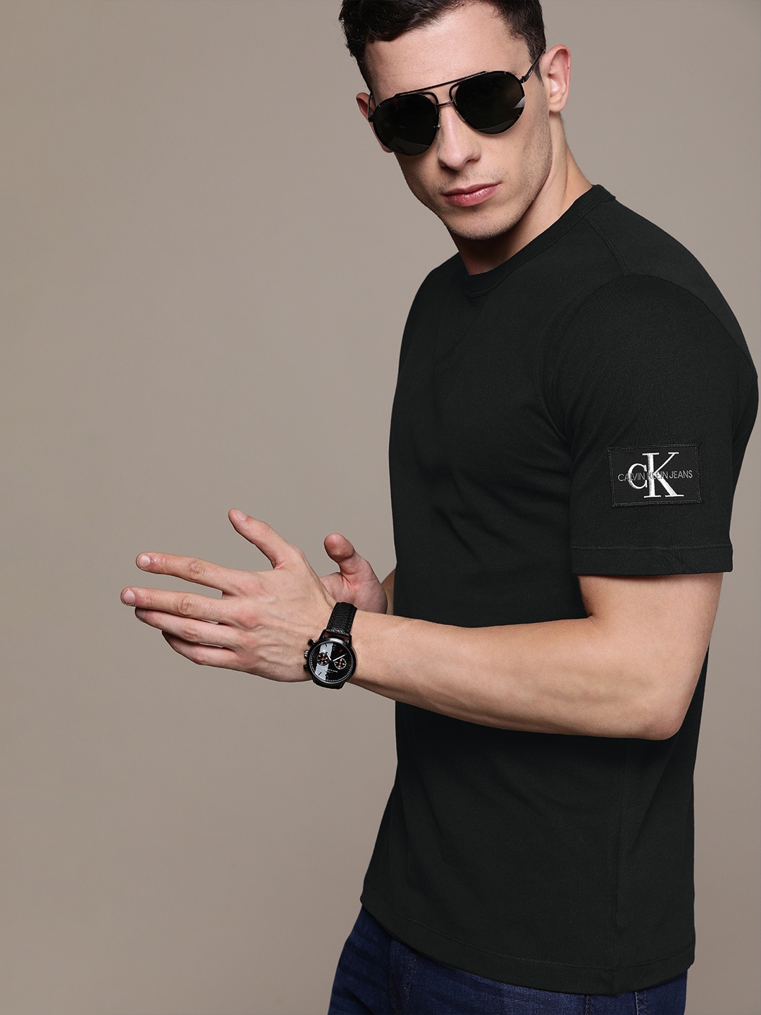 

Calvin Klein Jeans Men Black Solid Round Neck Pure Cotton T-shirt