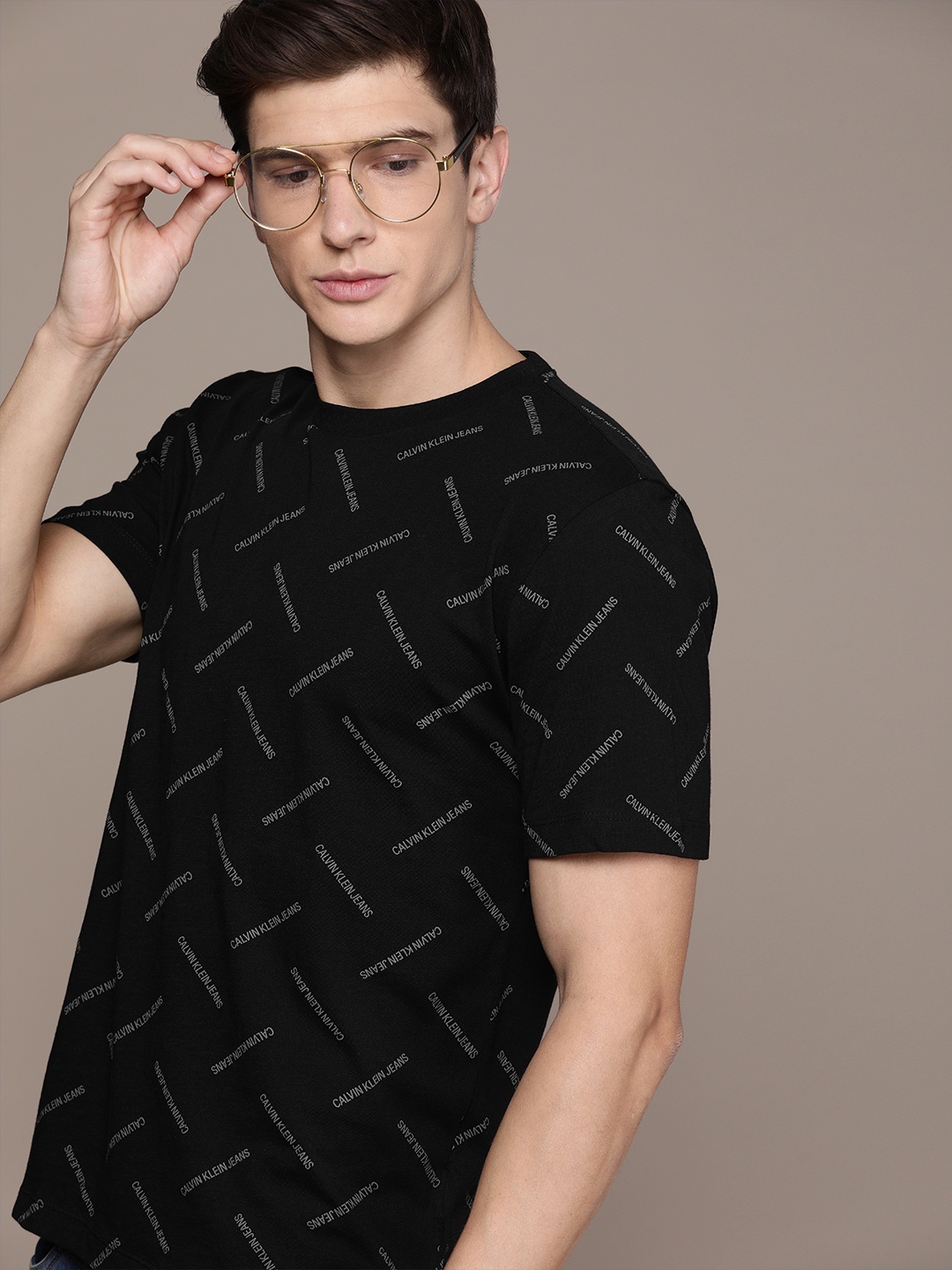 

Calvin Klein Jeans Men Black Grey Printed Round Neck Pure Cotton T-shirt