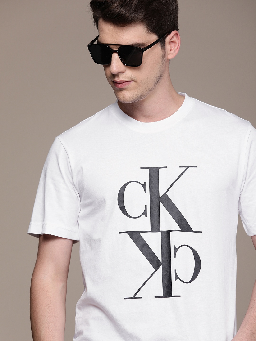 

Calvin Klein Jeans Men White Printed Round Neck Pure Cotton T-shirt