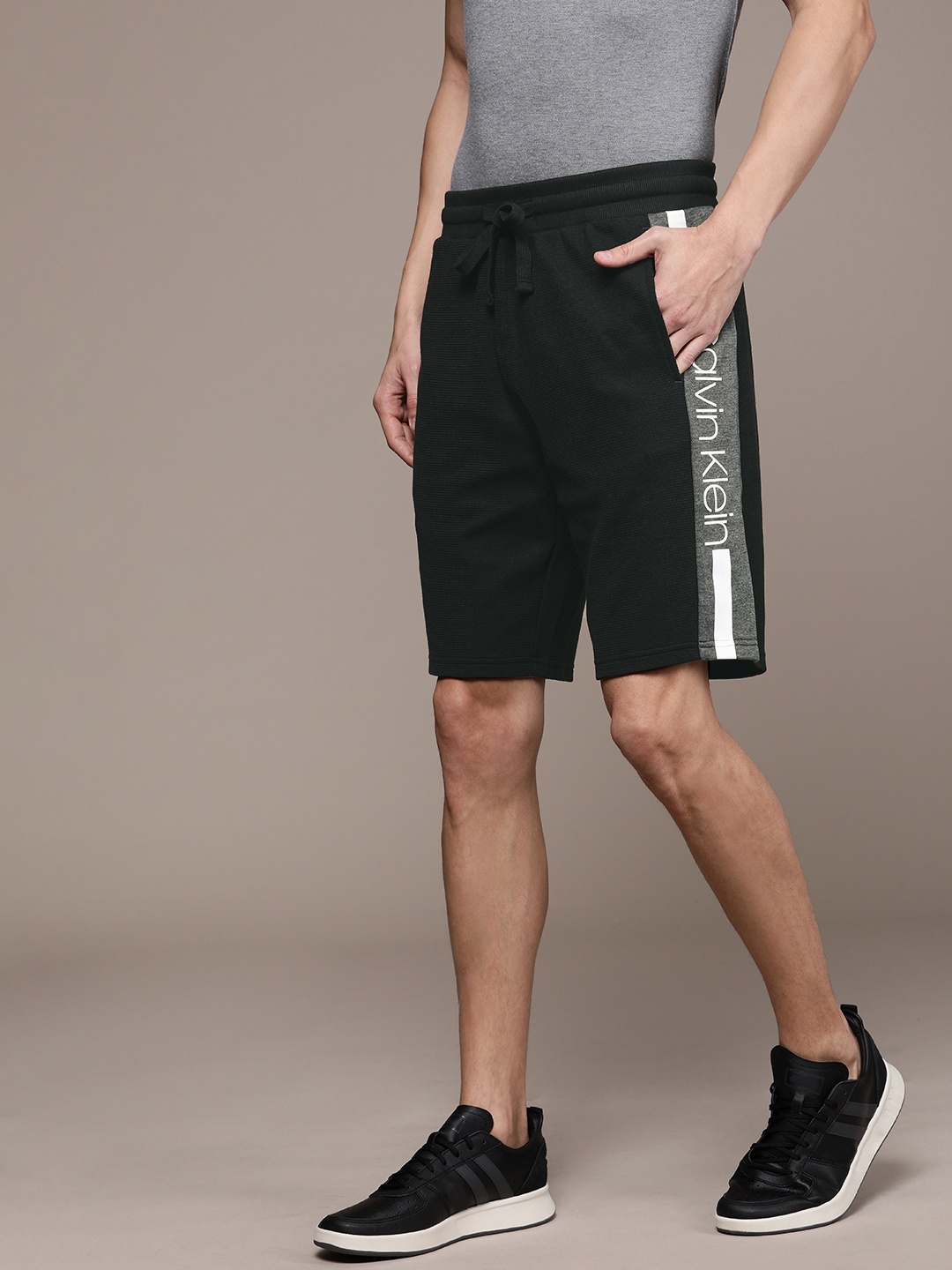 

Calvin Klein Jeans Men Black Solid Regular Fit Regular Shorts With Side Striped