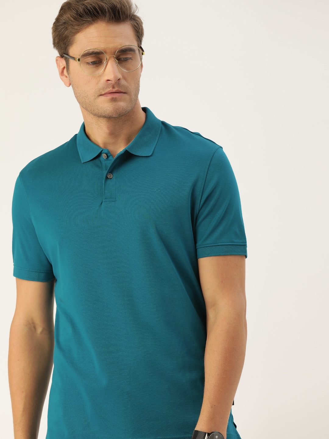 

Calvin Klein Jeans Men Green Solid Polo Collar Pure Cotton T-shirt