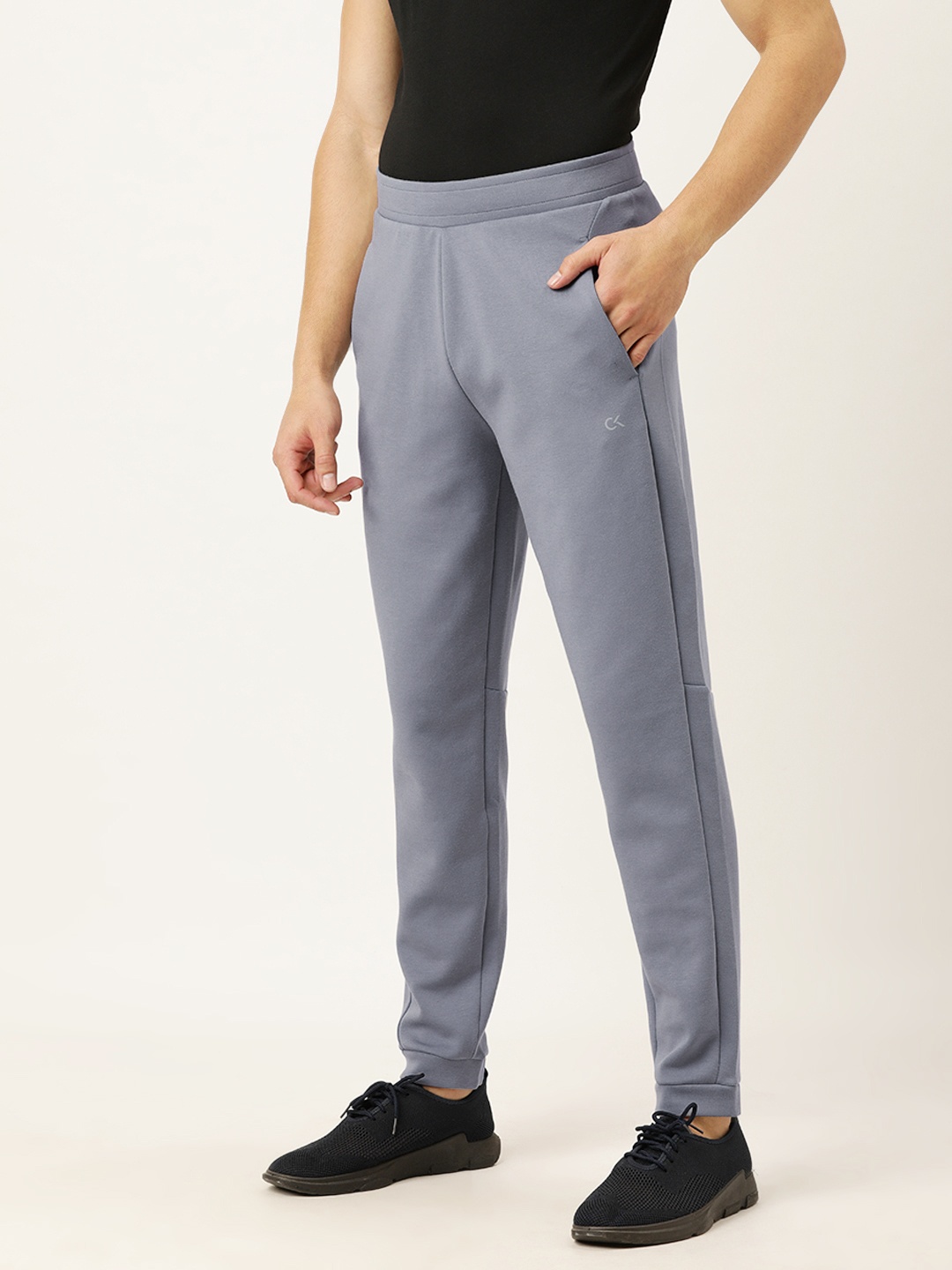 

Calvin Klein Jeans Men Grey Solid Slim Fit Track Pants