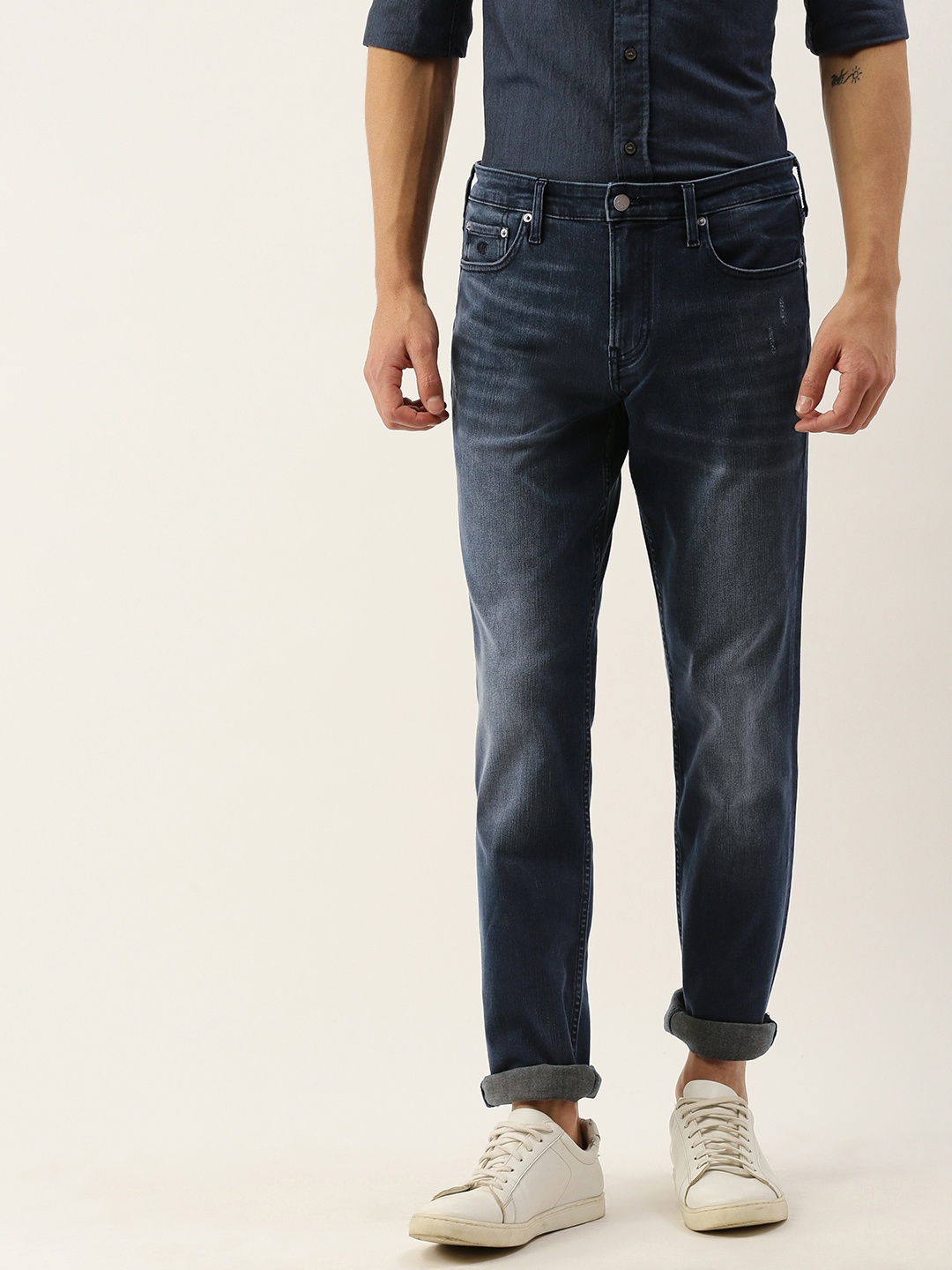 

Calvin Klein Jeans Men Blue Slim Fit Mid-Rise Low Distress Stretchable Jeans