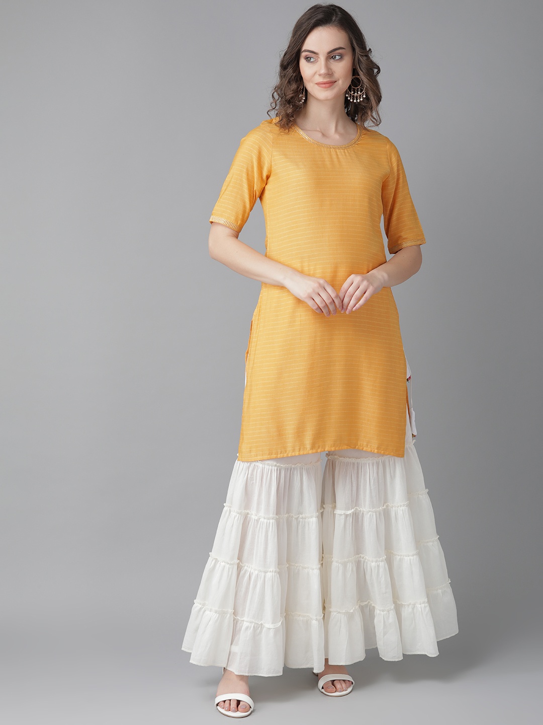 

Indo Era Women Mustard Yellow & White Self Striped Kurta with Sharara