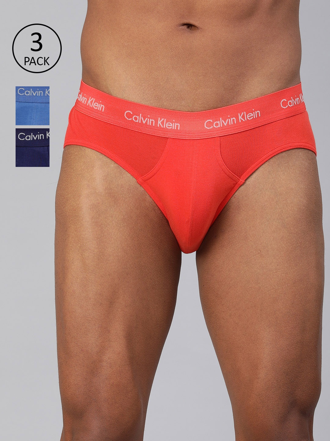 

Calvin Klein Underwear Men Pack of 3 Solid Briefs U2661WEU, Orange