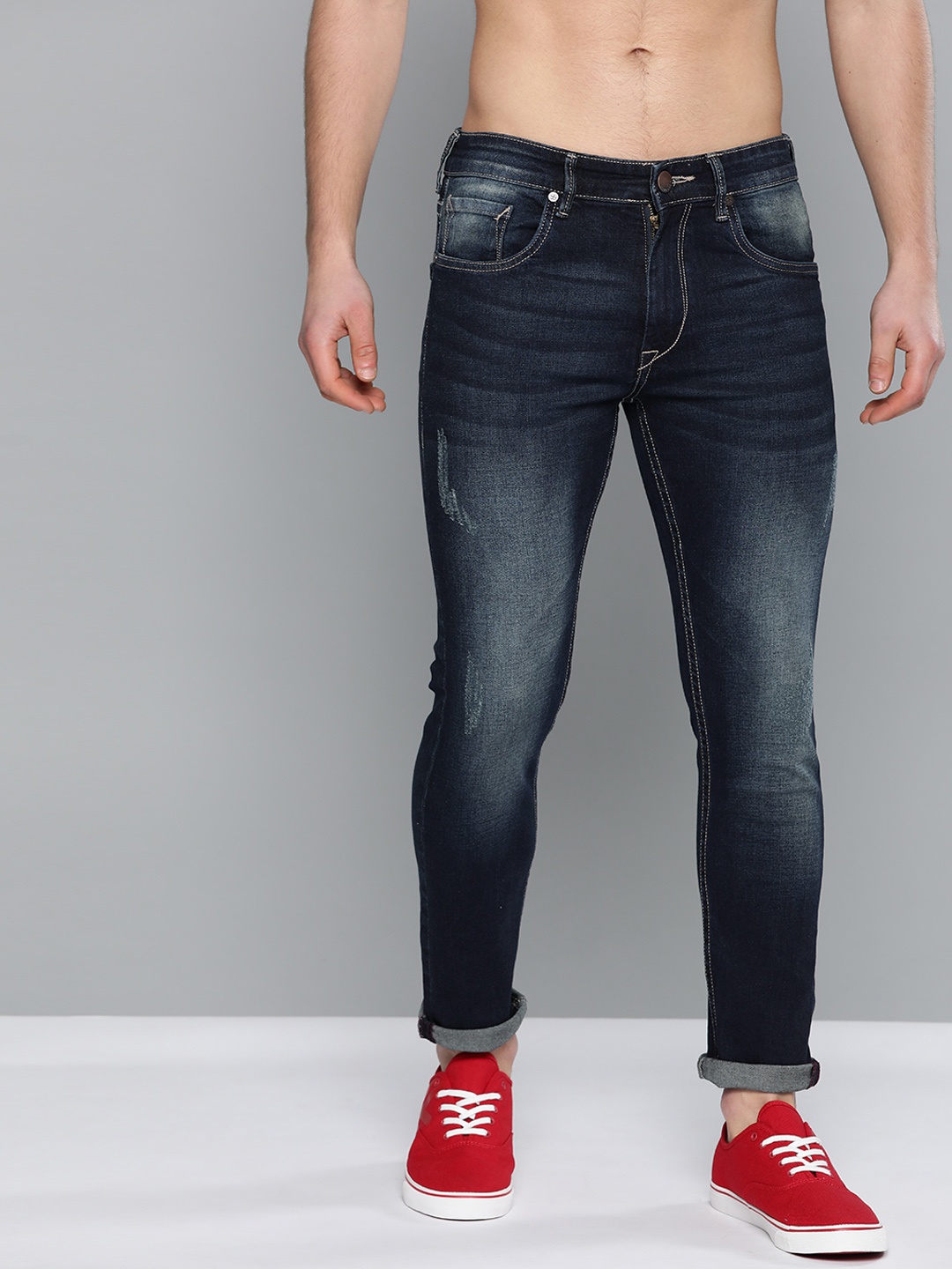 

HERE&NOW Men Navy Blue Skinny Fit Mid-Rise Low Distress Stretchable Jeans