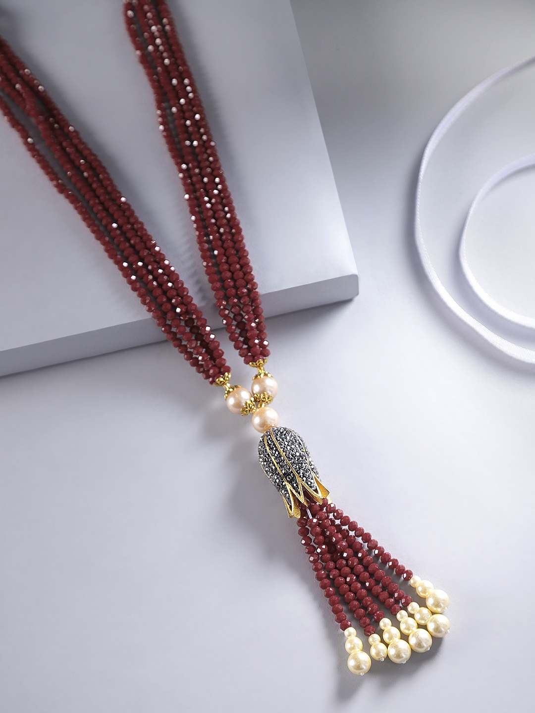 

Jewels Galaxy Maroon & Off-White Gold-Plated Stone Studded & Beaded Tasselled Necklace