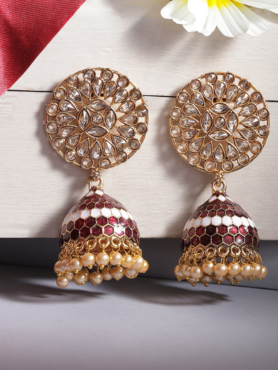 

Jewels Galaxy Maroon Gold Plated Stone Studded & Beaded Enamelled Dome Shaped Jhumkas