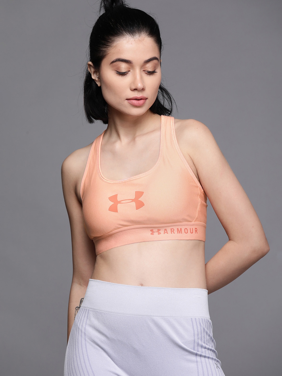 

UNDER ARMOUR Women Peach Coloured Mid Iridescent Crossback Heather Sports Bra 1351997-689