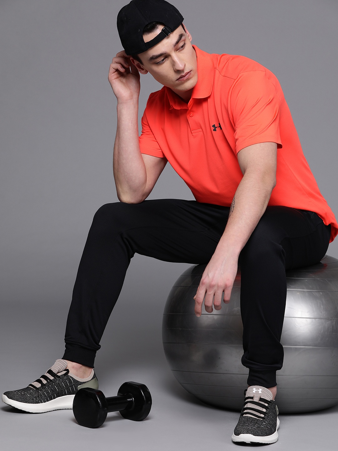 

UNDER ARMOUR Men Neon Orange Performance 2.0 Self Design Polo T-Shirt
