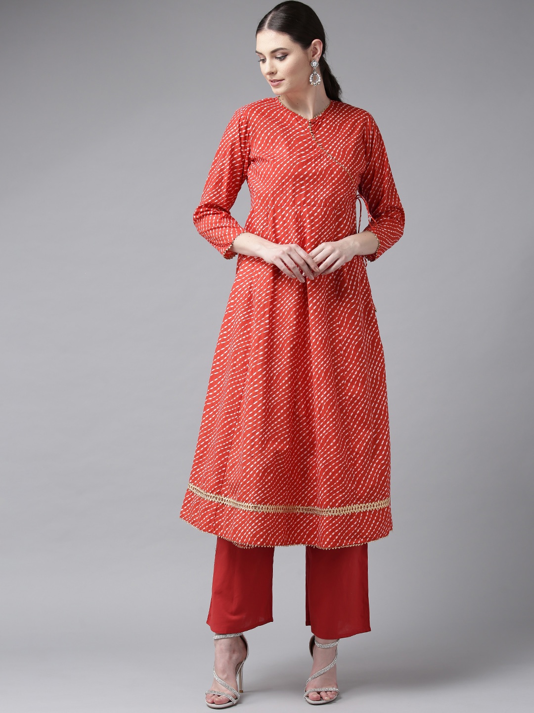 

Bhama Couture Women Red & White Bandhan Print Angrakha Kurta with Palazzos