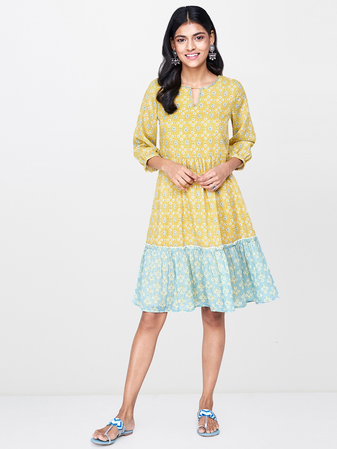 

Global Desi Women Yellow & Teal Blue Printed Tiered Fit and Flare Dress