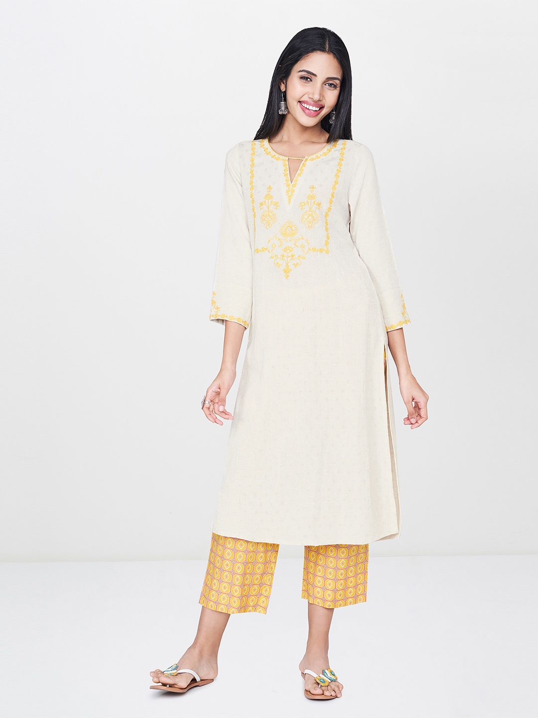 

Global Desi Women Off-White & Yellow Yoke Design A-Line Kurta