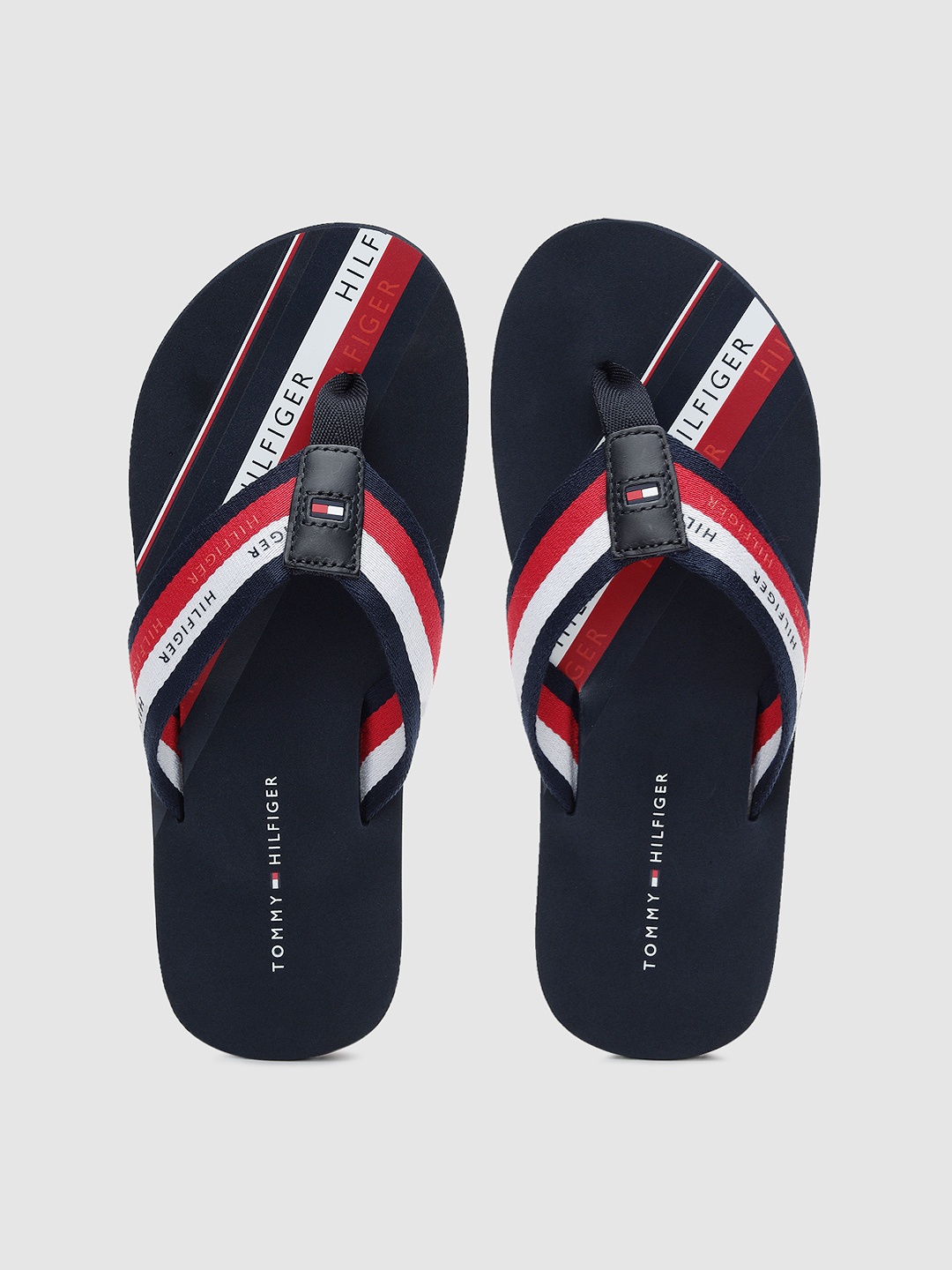 

Tommy Hilfiger Men Navy Blue & Red Striped Thong Flip-Flops