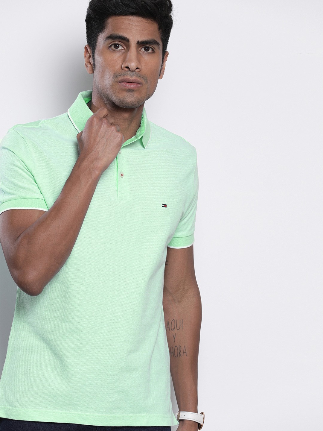 

Tommy Hilfiger Men Green Solid Polo Collar Pure Cotton T-shirt