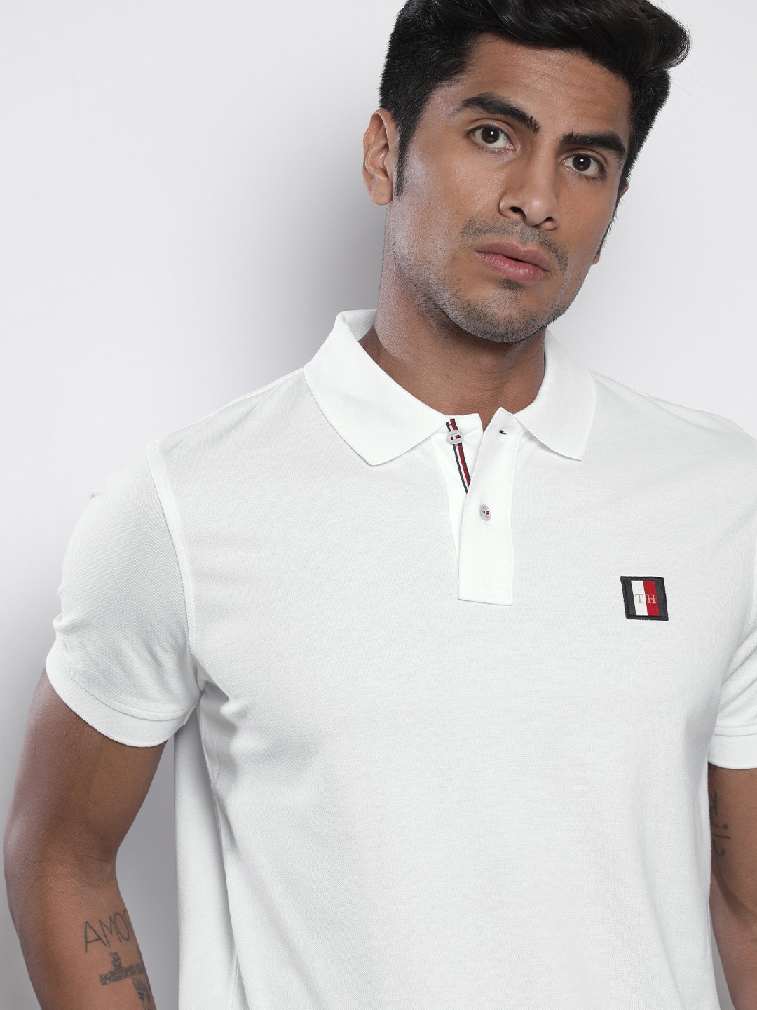 

Tommy Hilfiger Men White Solid Polo Collar Pure Cotton T-shirt