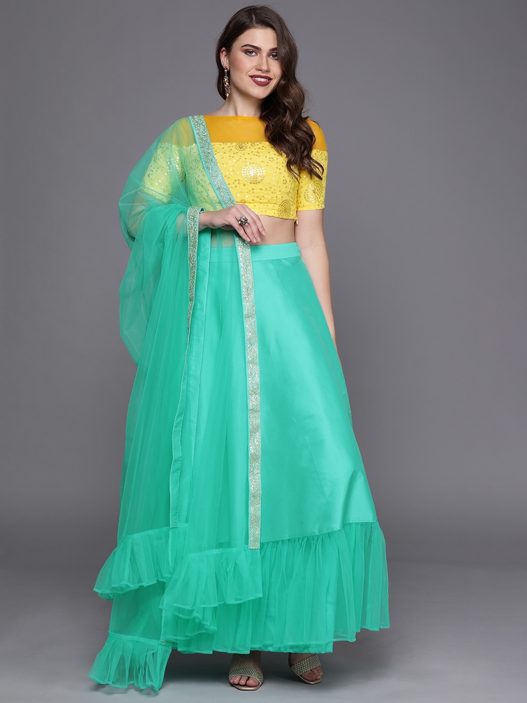 

Ethnovog Yellow Turquoise Blue Made To Measure Lehenga Choli