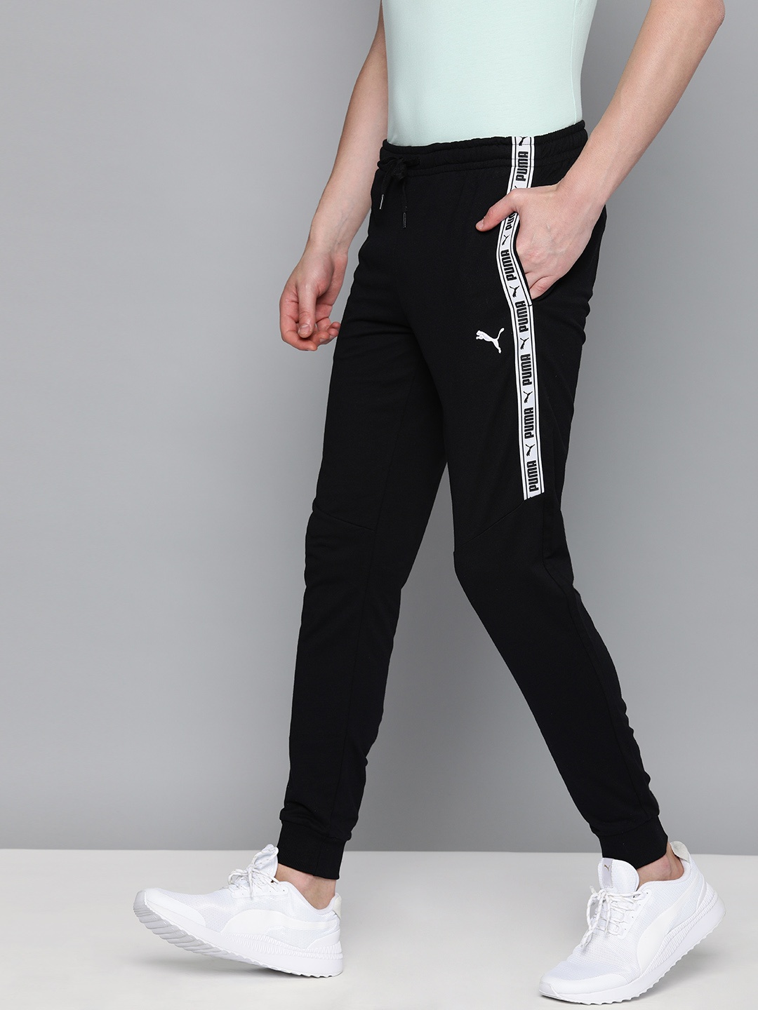 

Puma Men Black Slim Fit Solid Tape Sweat Cropped Joggers with Side Taping