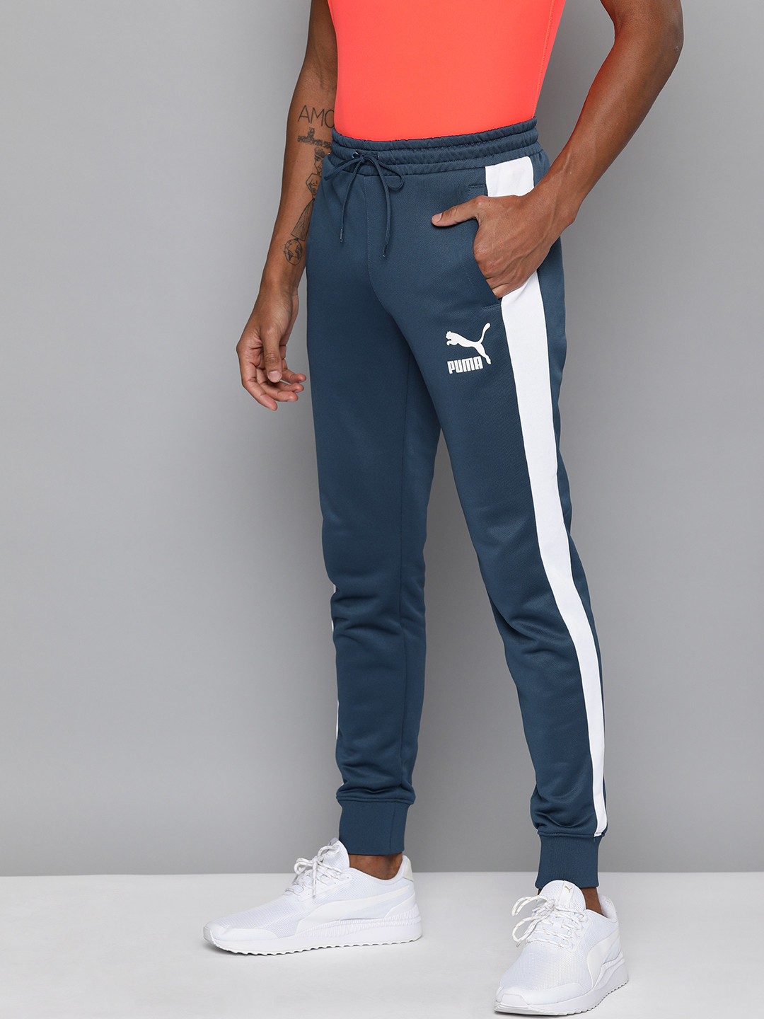 

Puma Men Navy Blue Straight Fit Iconic T7 Solid Sustainable Joggers with Side Stripes