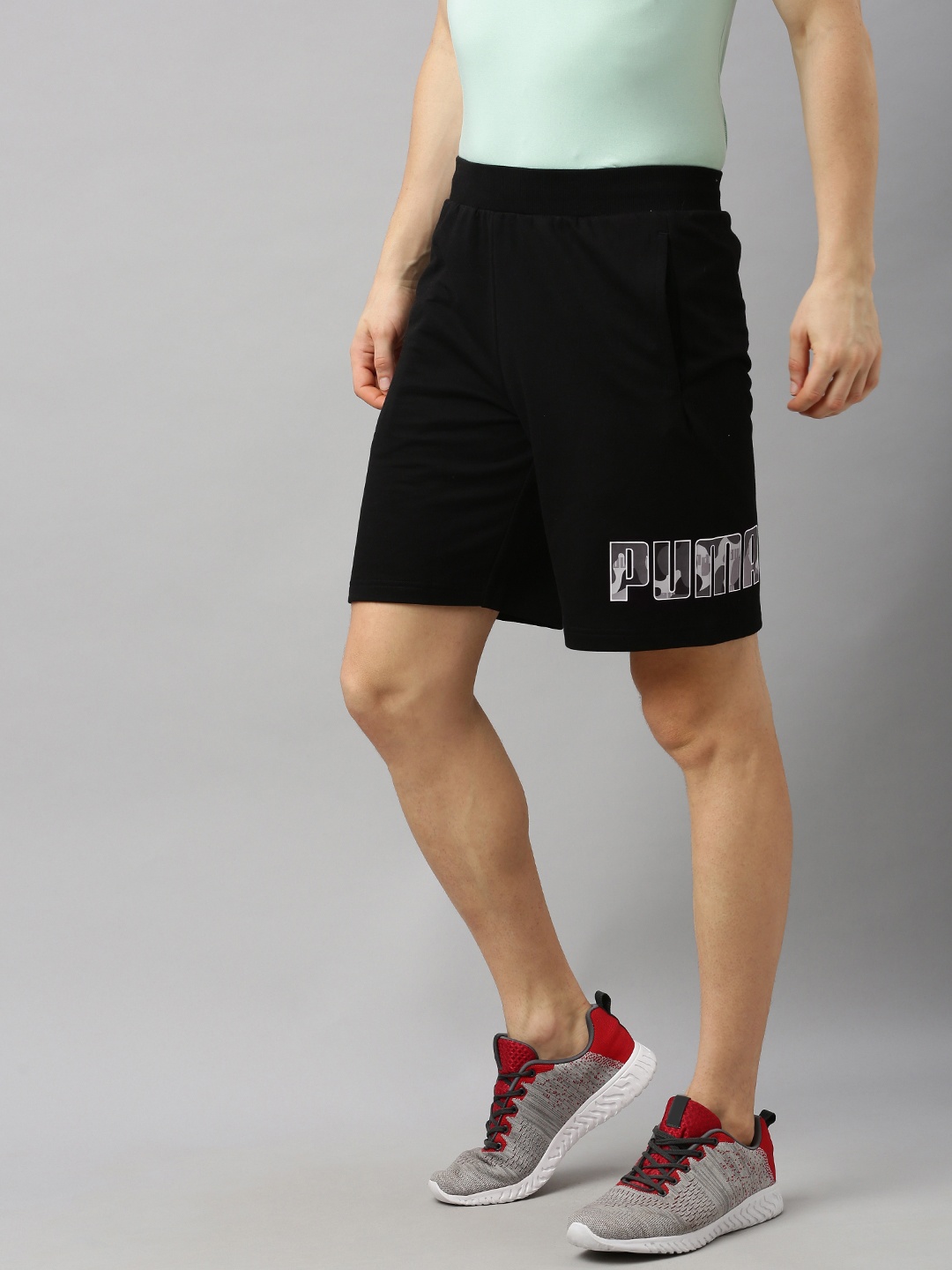

Puma Men Black Solid Regular Fit Regular Shorts