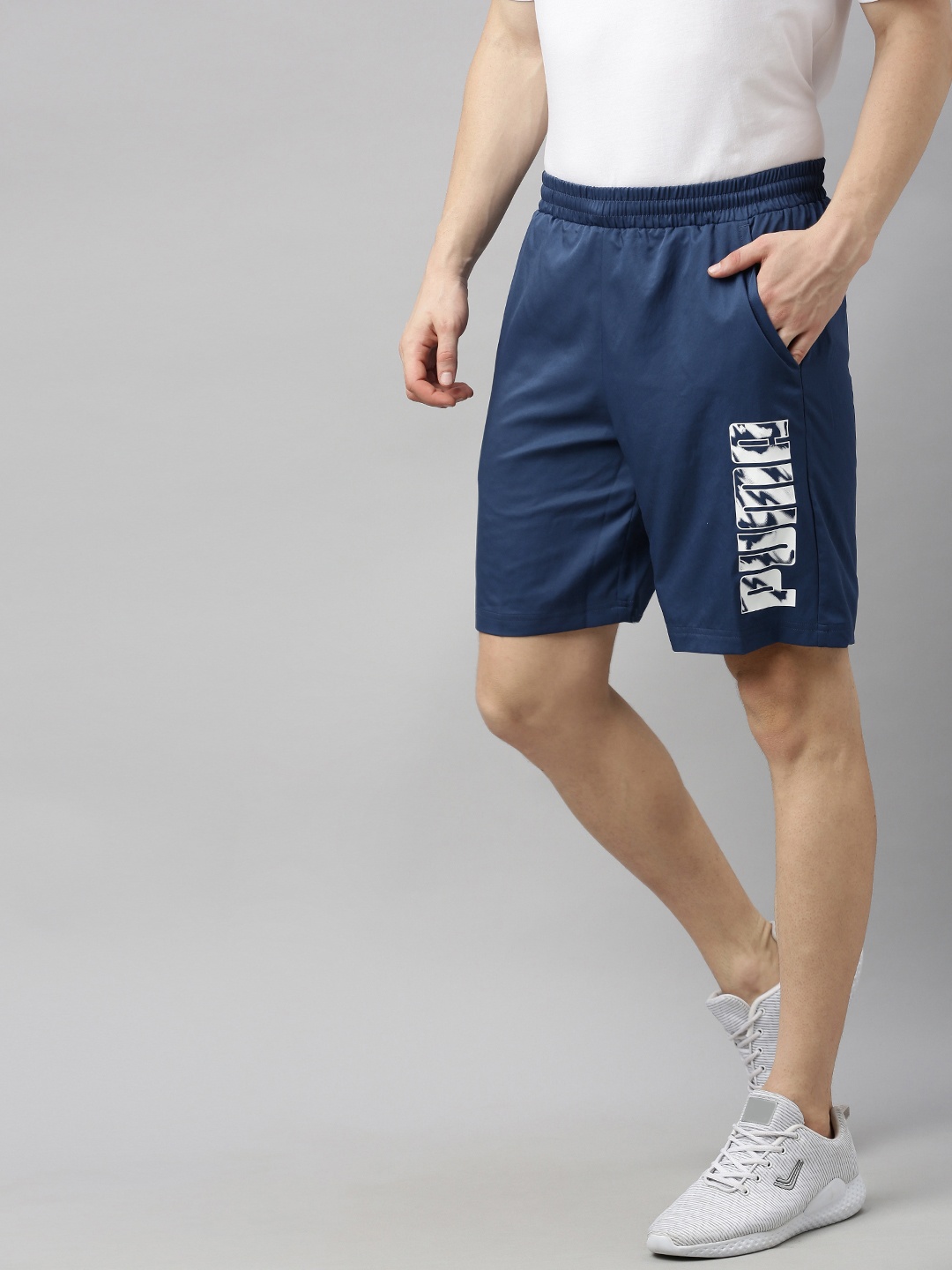 

Puma Men Navy Blue Graphic Printed Regular Fit Woven Sports Shorts
