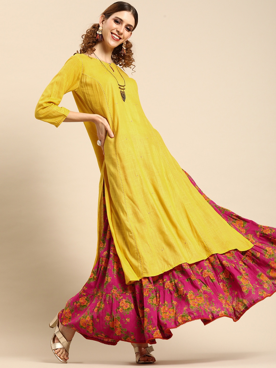 

Varanga Women Yellow & Pink Solid Kurta with Skirt