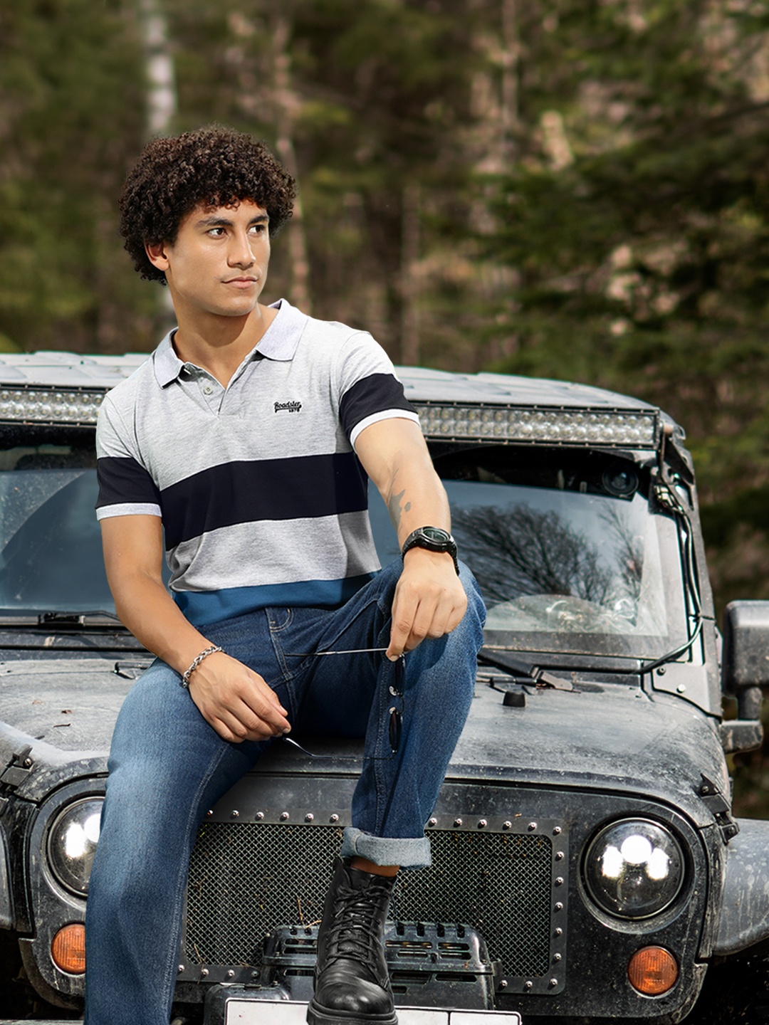 

Roadster Men Grey Melange & Black Striped Polo Collar T-shirt