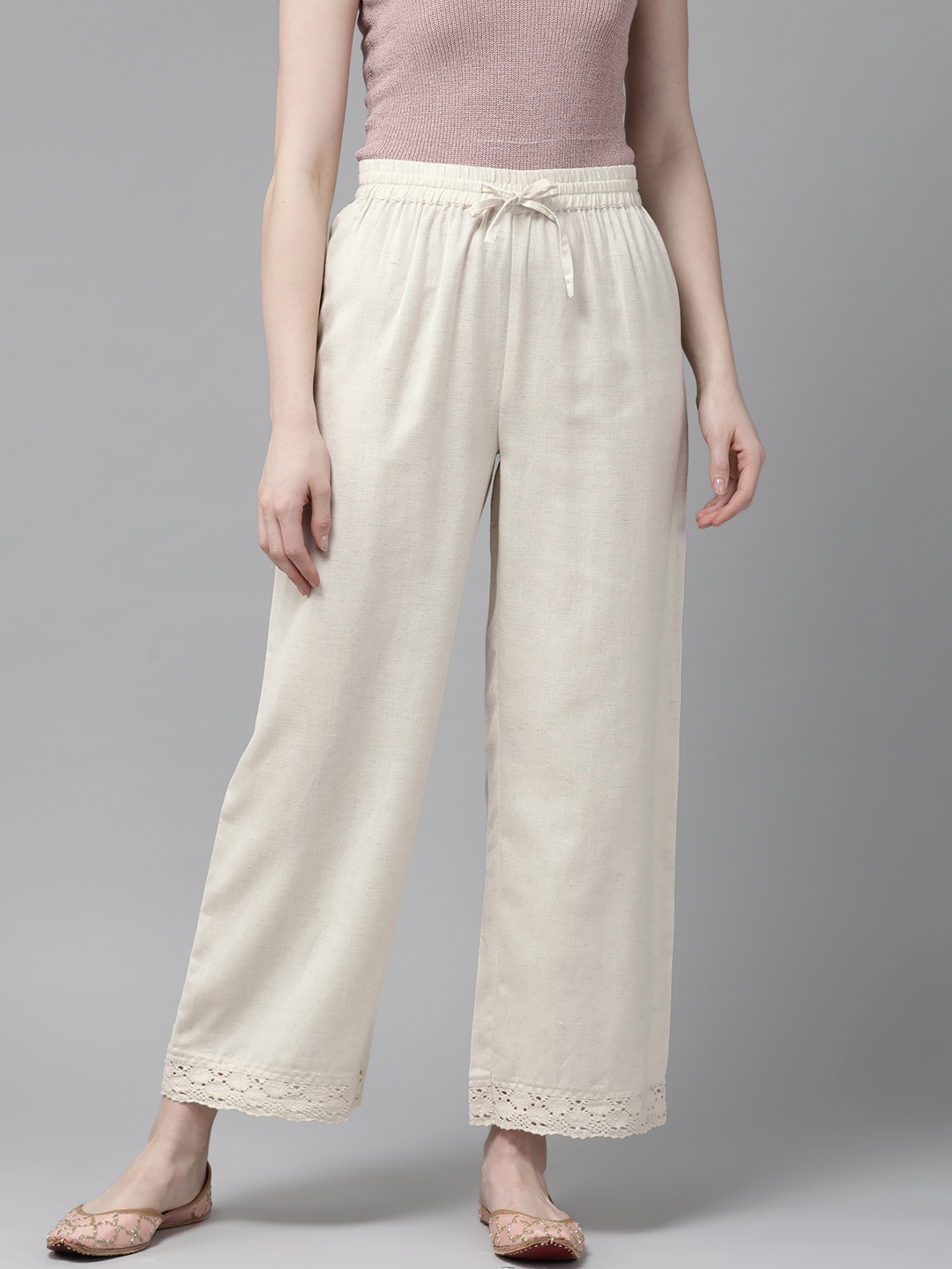 

Juniper Women Off-White Solid Straight Palazzos