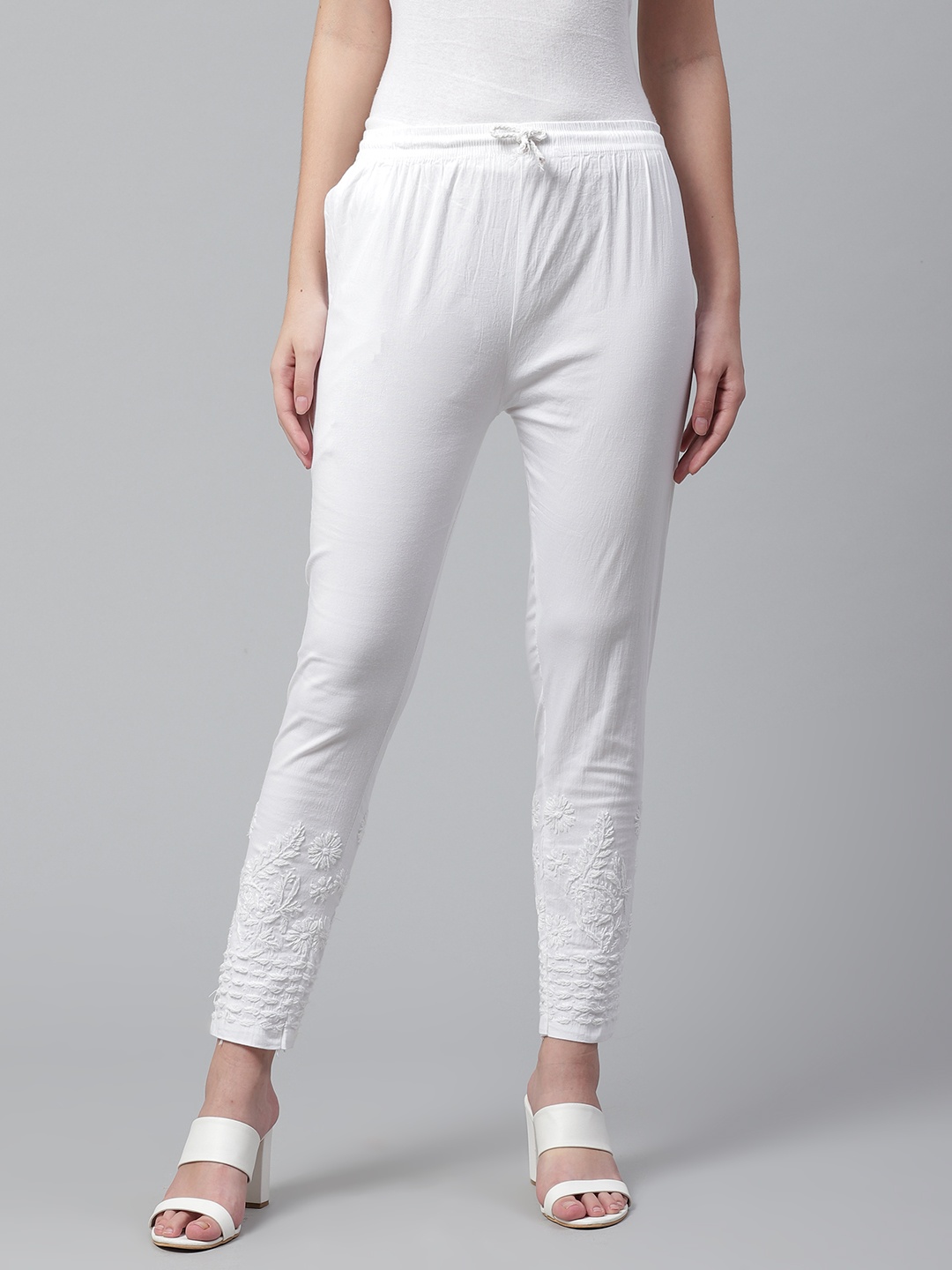 

Saadgi Women White Solid Regular Trousers