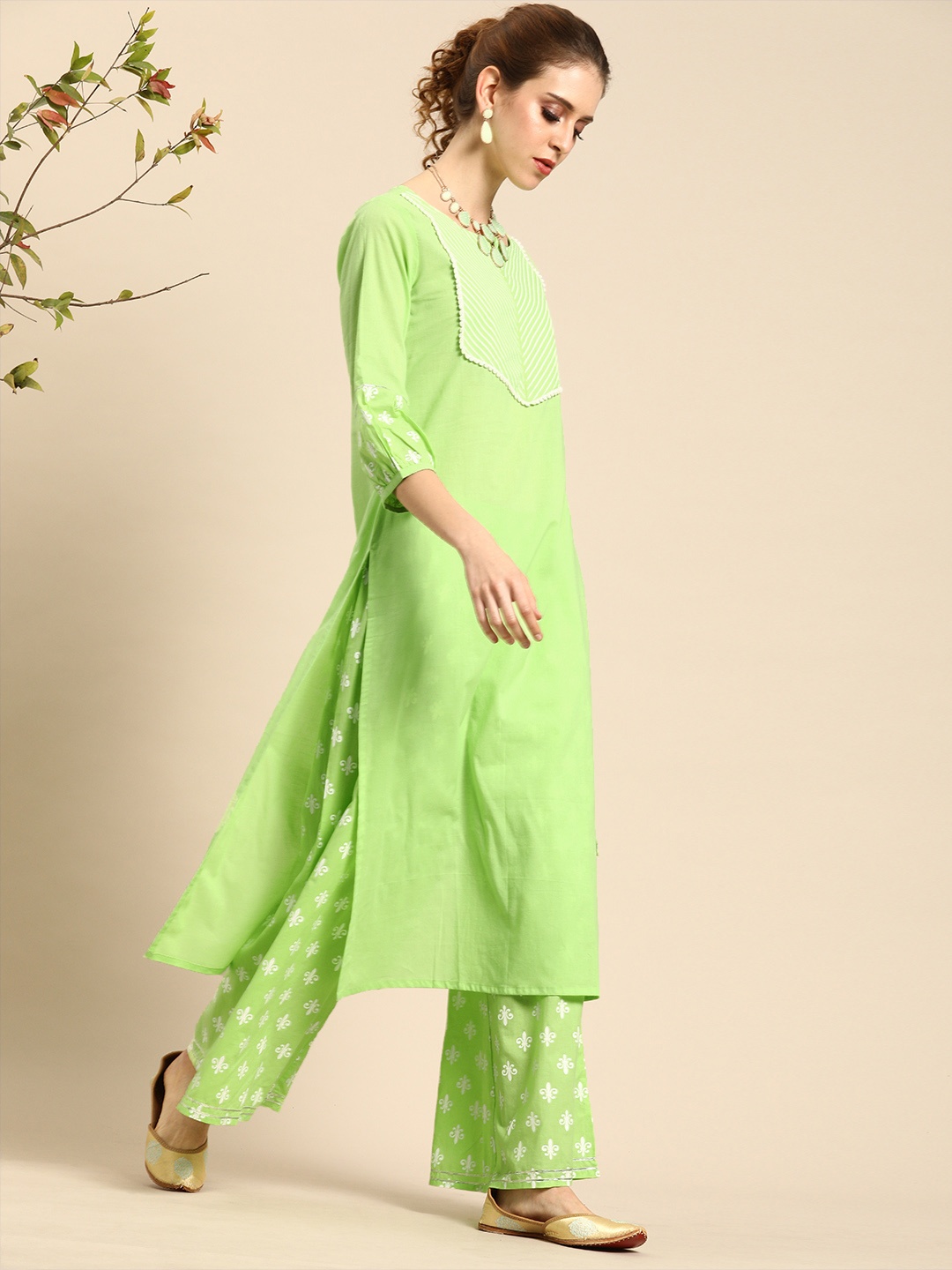 

Varanga Women Green & White Yoke Design Kurta with Palazzos