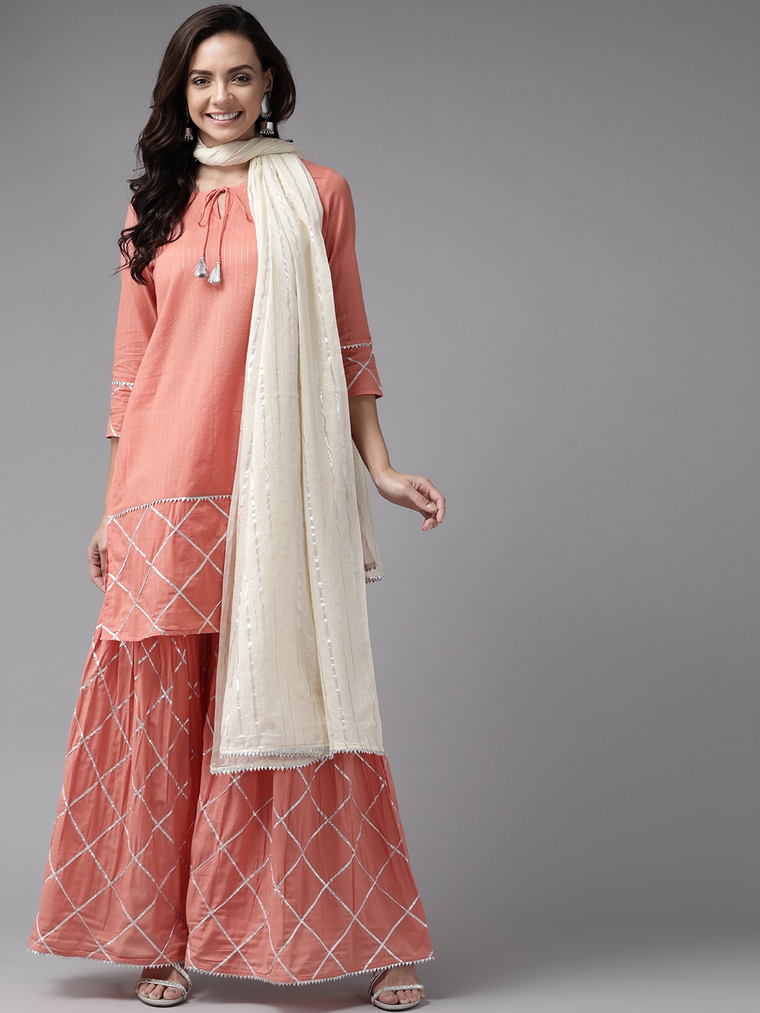 

anayna Women Peach-Coloured & Silver Striped Kurta with Sharara & Dupatta