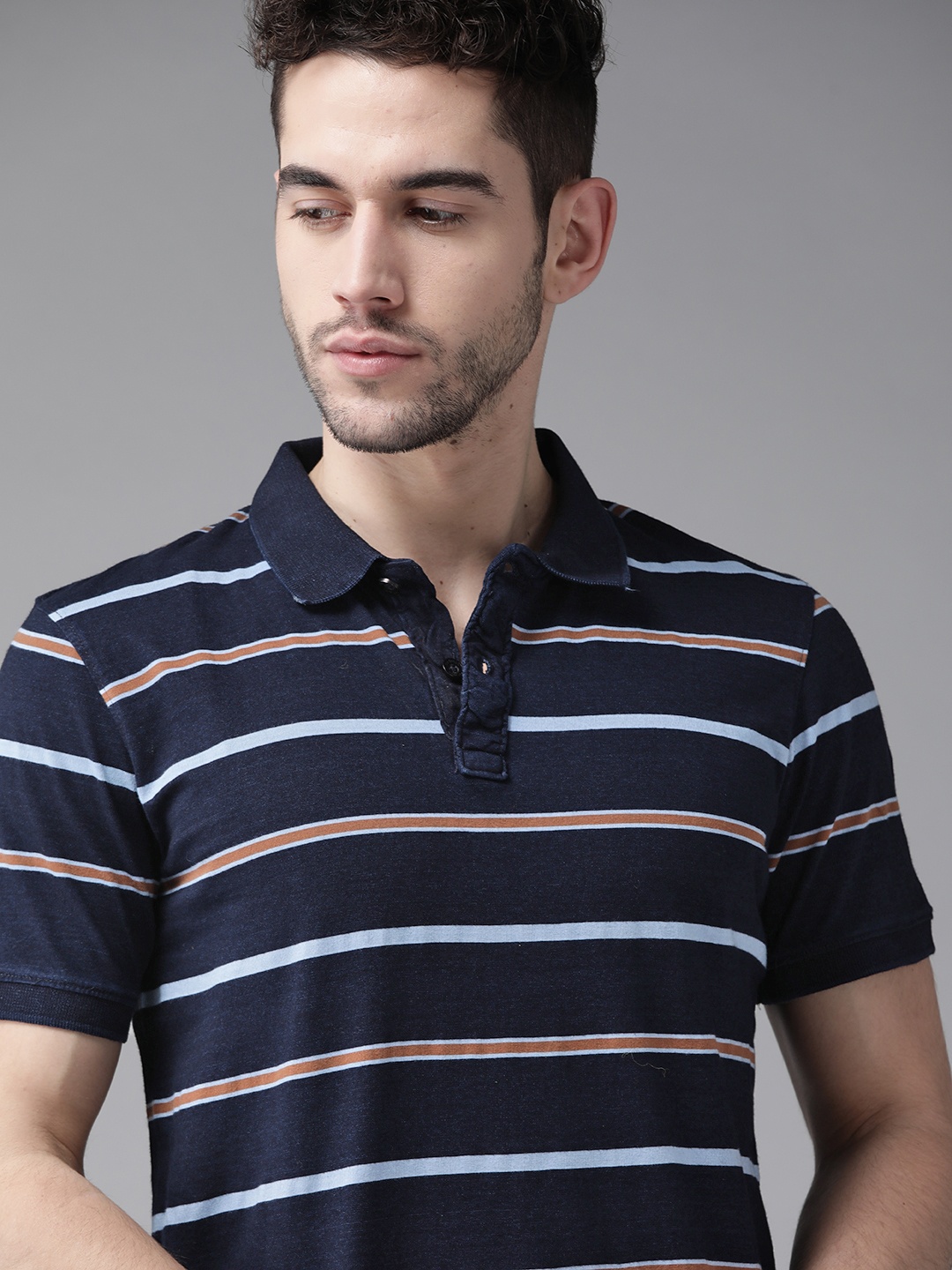 

Roadster Men Navy Blue & Rust Orange Striped Polo Collar T-shirt
