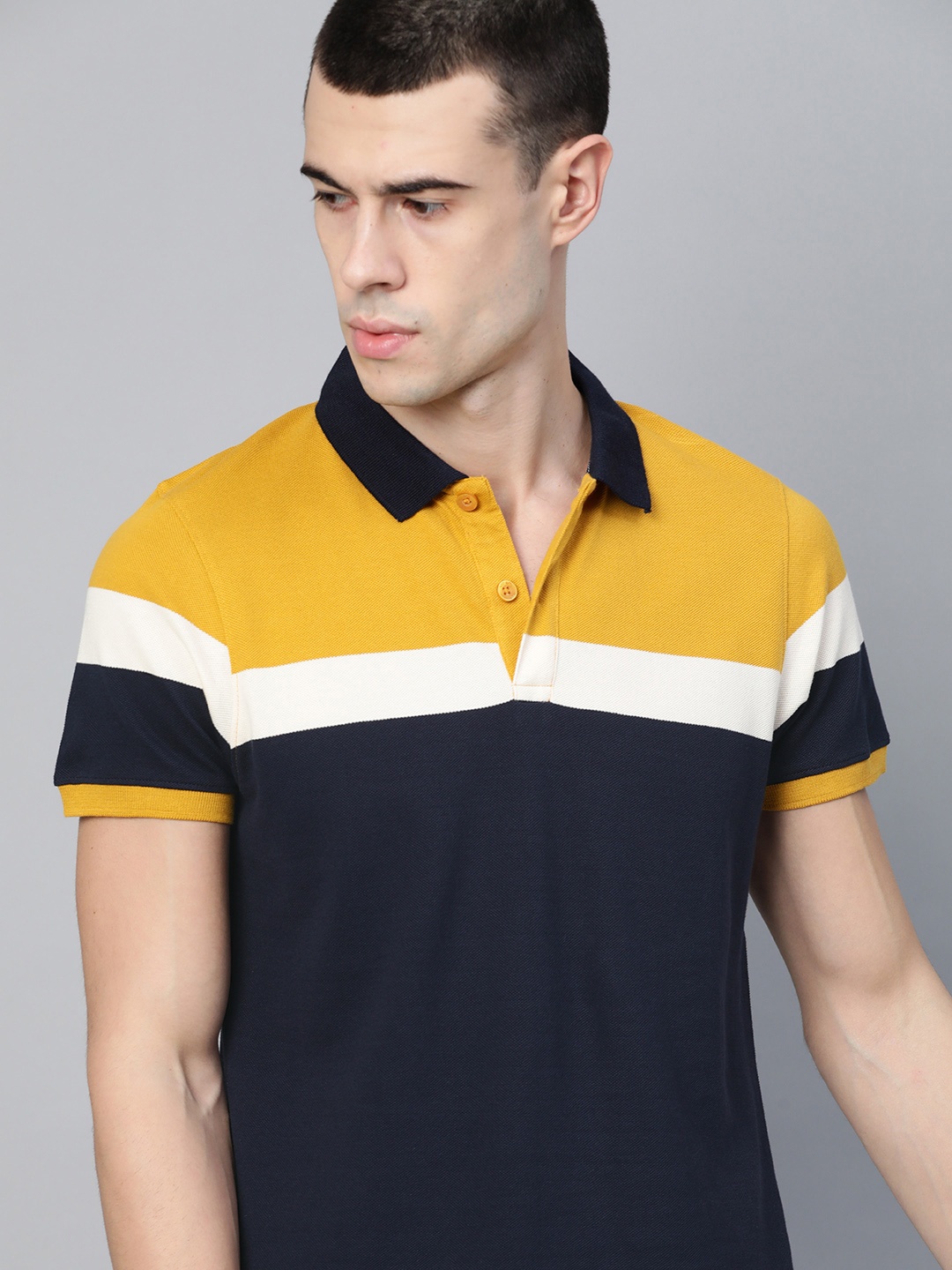 

Roadster Men Navy Blue Mustard Yellow Colourblocked Polo Collar Pure Cotton T-shirt