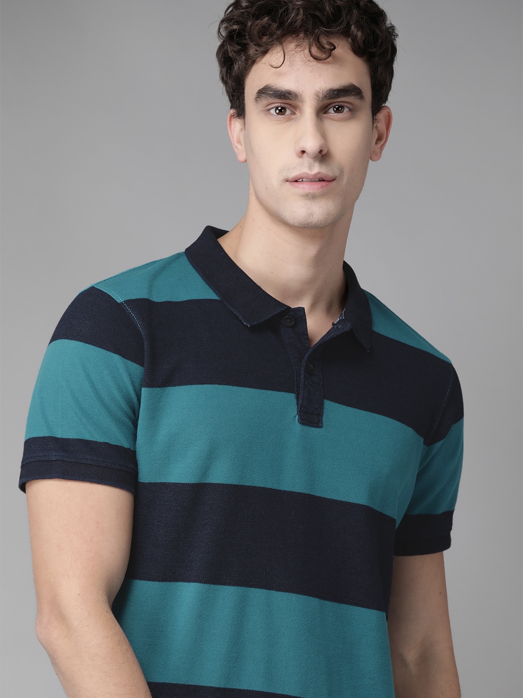 

Roadster Men Blue Striped Polo Collar T-shirt