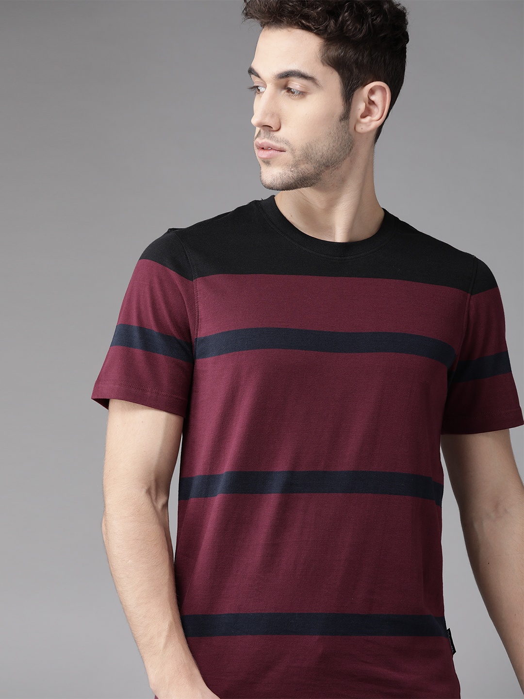 

Roadster Men Maroon and Navy Blue Striped Round Neck T-shirt