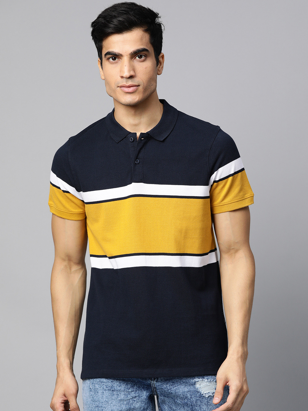 

Roadster Men Navy Blue & Mustard Yellow Colourblocked Polo Collar T-shirt