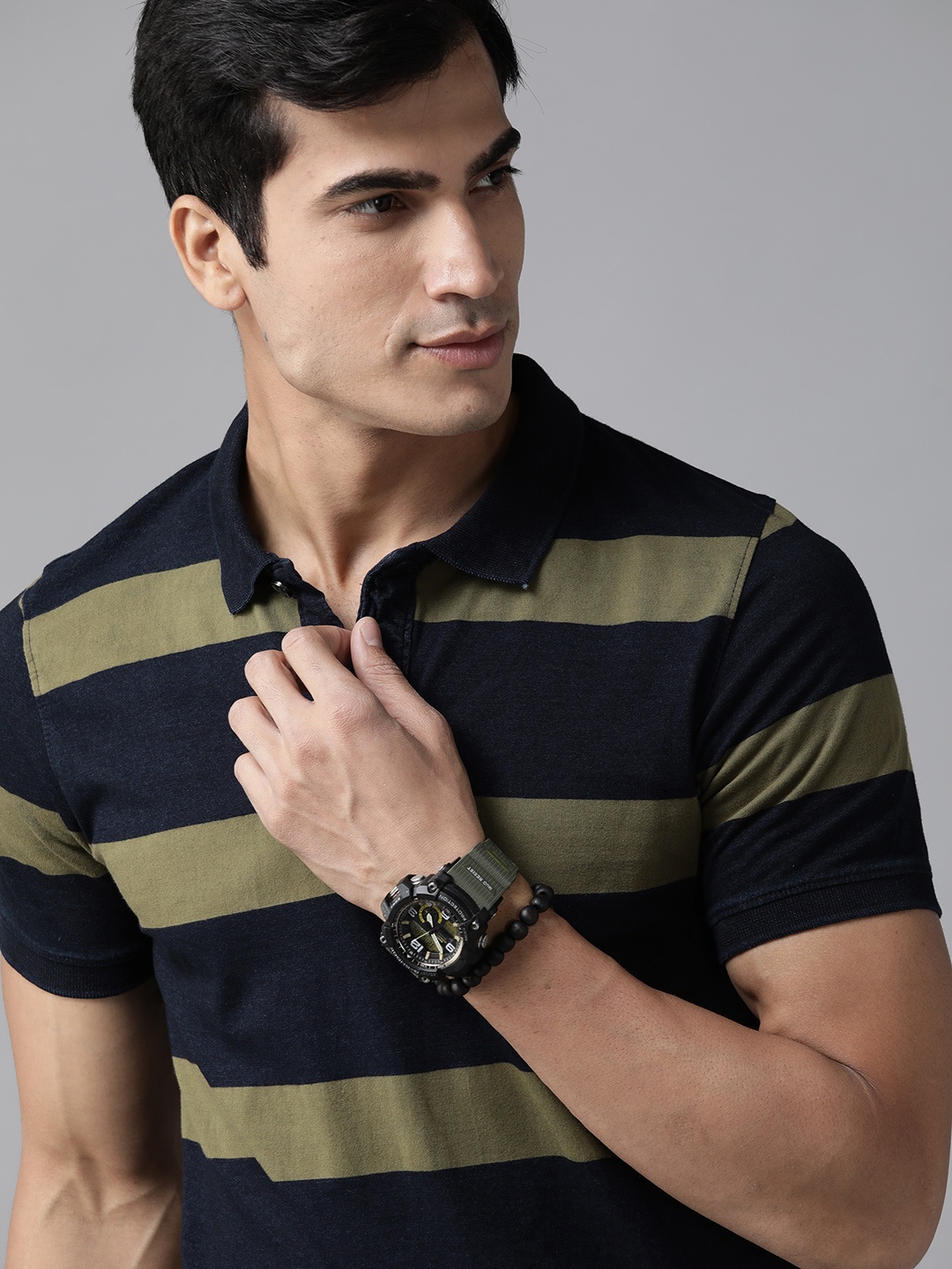 

Roadster Men Navy Blue & Olive Green Striped Polo Collar T-shirt