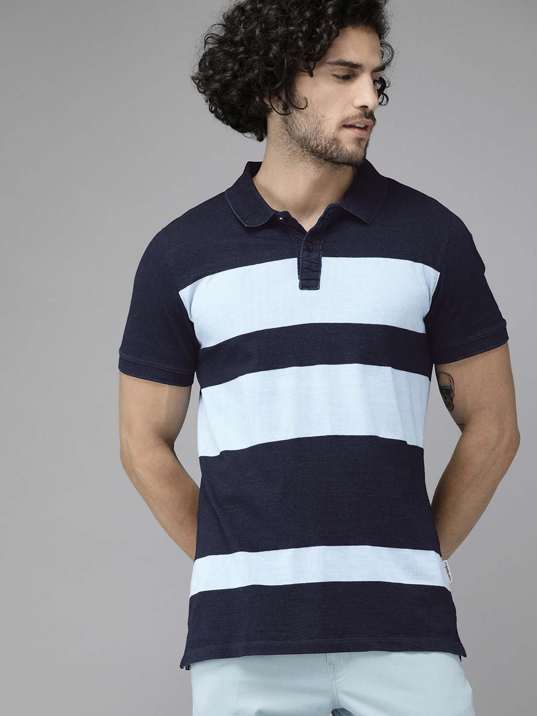 

Roadster Men Navy Blue Striped Polo Collar T-shirt