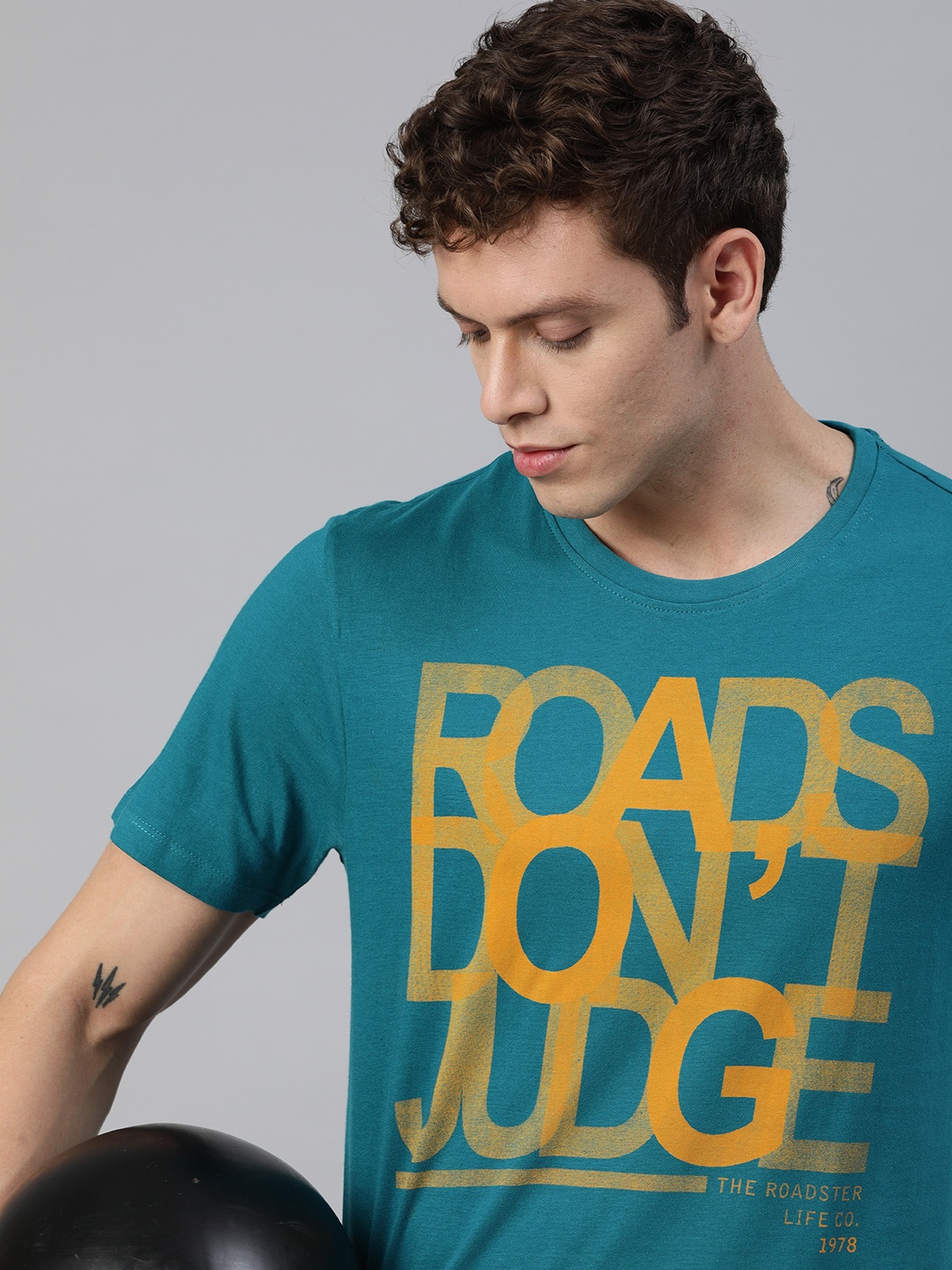 

Roadster Men Teal Green and Orange Printed Round Neck T-shirt