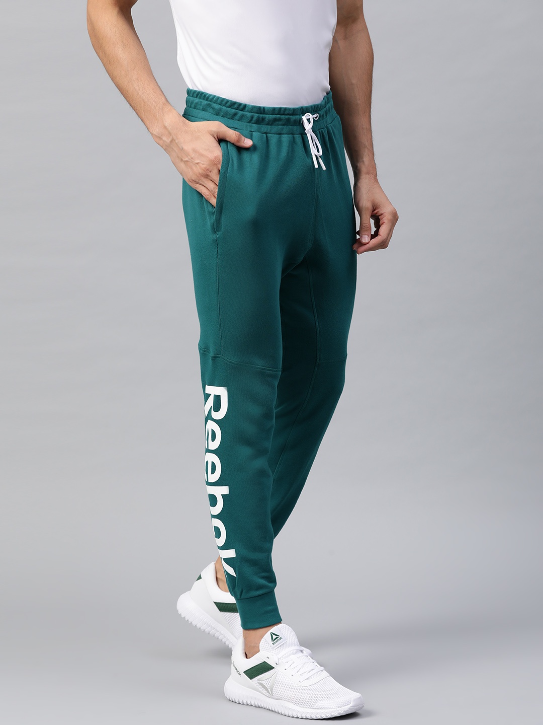 

Reebok Men Green Training Essentials Linear Logo Solid Joggers