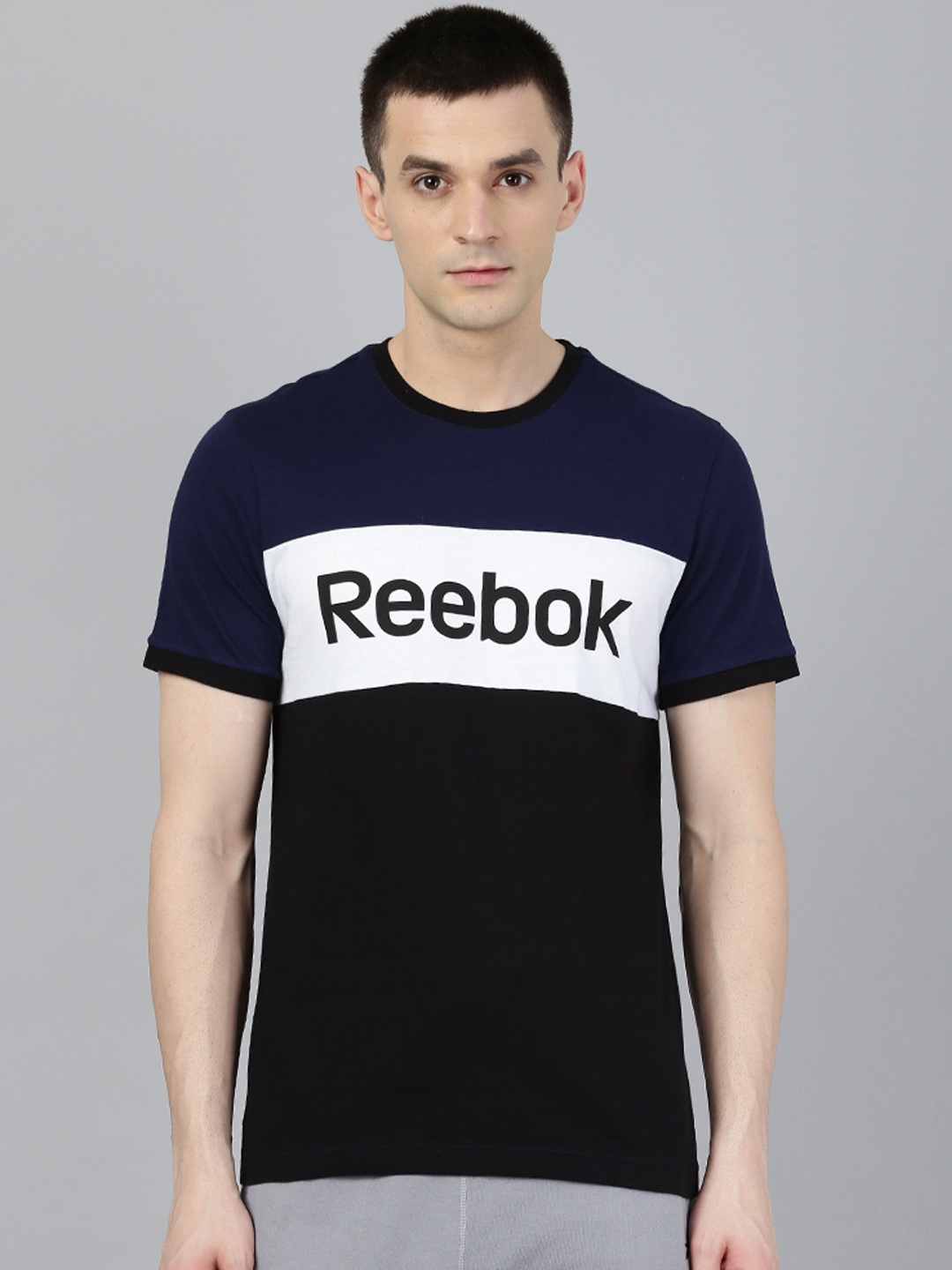 

Reebok Men Black & Navy Blue TE LL Colourblocked Round Neck T-Shirt