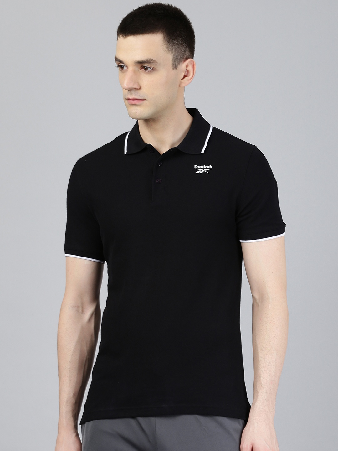 

Reebok Men Black Solid Essentials Polo Training T-shirt