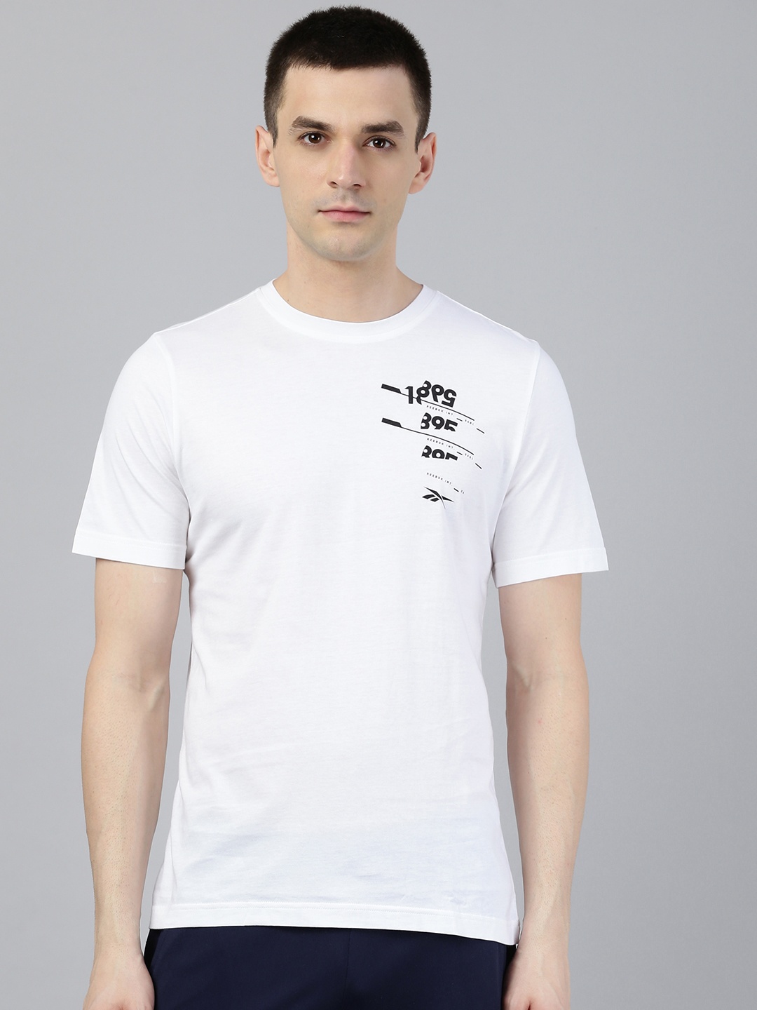 

Reebok Men White Black Graphic Printed Slim Fit Training Pure Cotton T-shirt