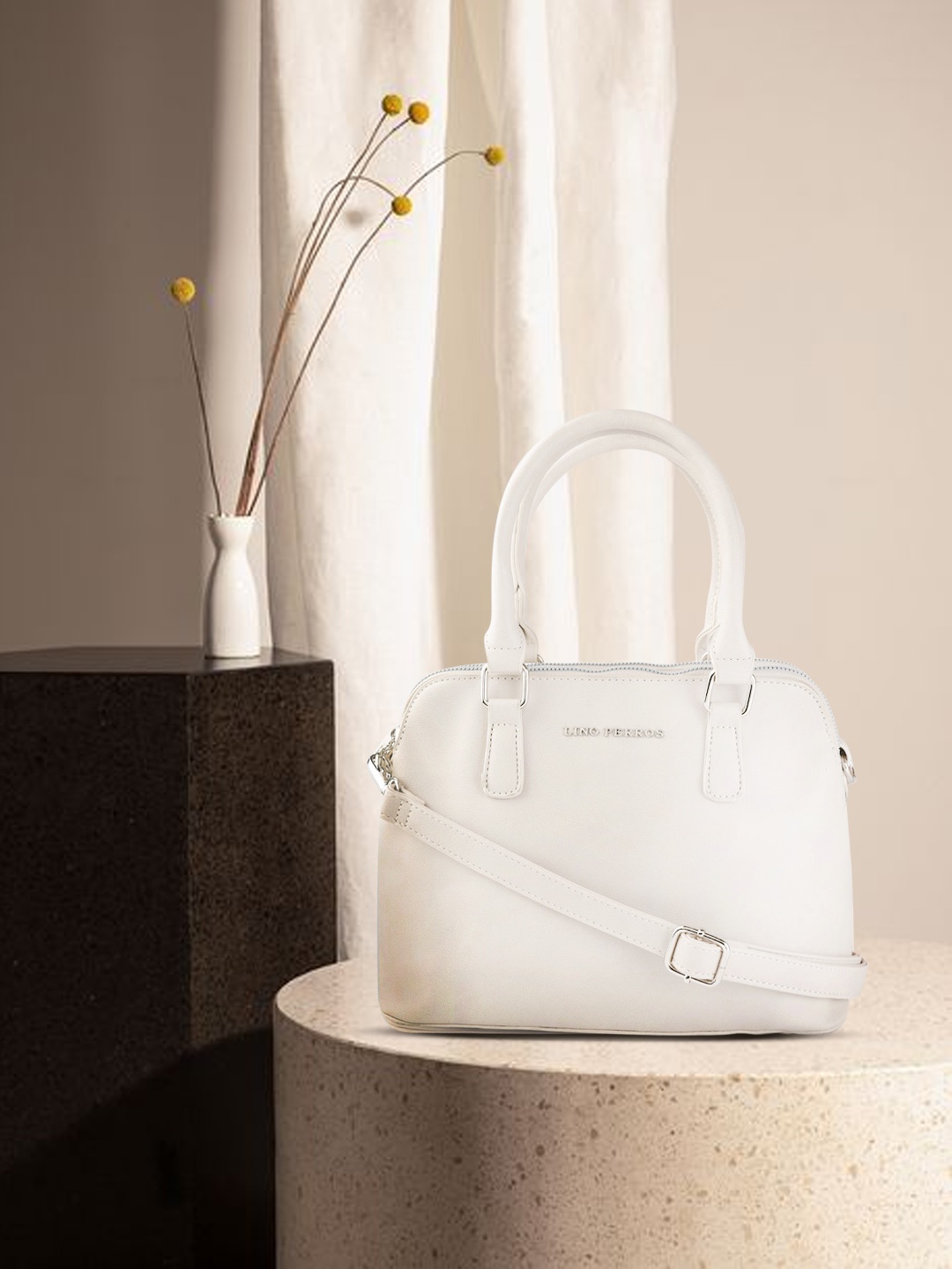 

Lino Perros Off-White Solid Handheld Bag