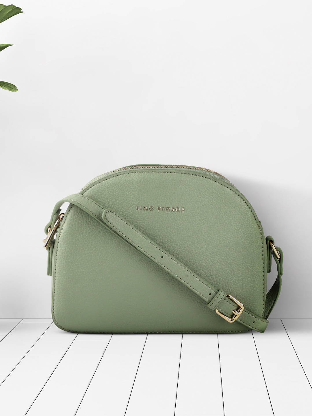 

Lino Perros Green Solid Half Moon Sling Bag