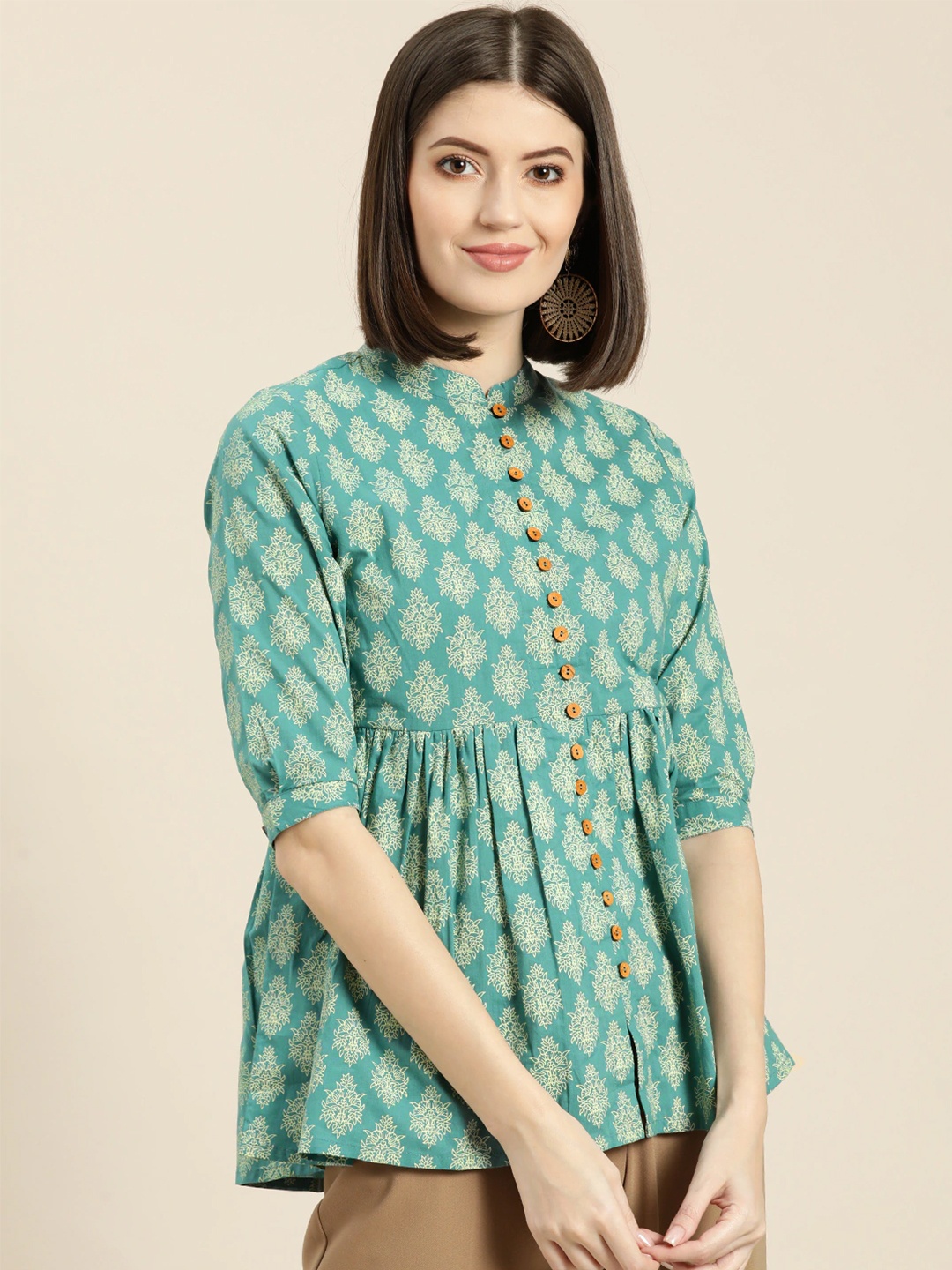 

Shae by SASSAFRAS Women Teal Blue & Off-White Printed A-Line Pure Cotton Top