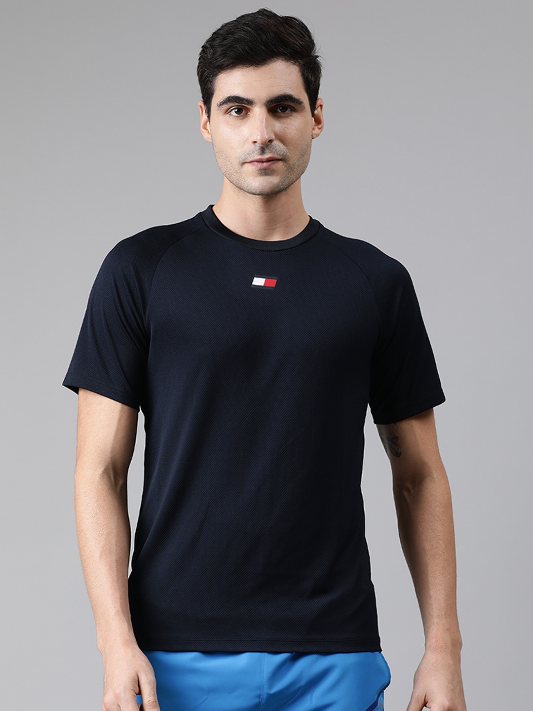 

Tommy Hilfiger Men Navy Blue Solid Standard Fit Round Neck T-shirt with Print Detail