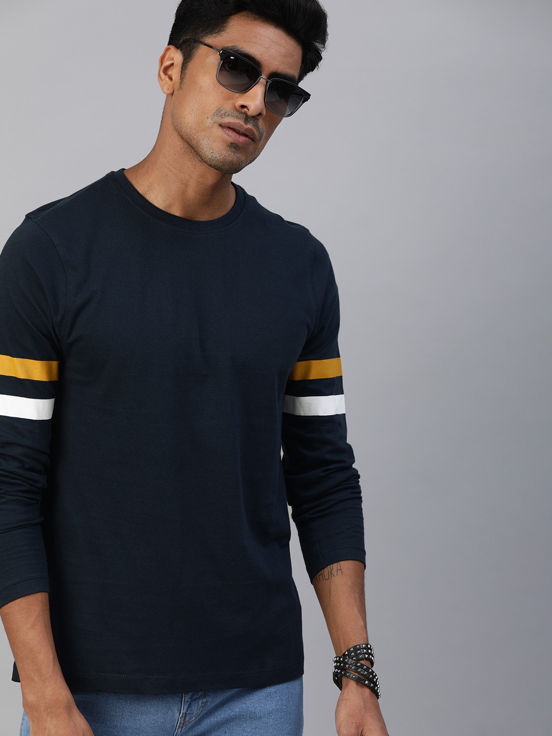 

Roadster Men Navy Blue Solid Round Neck Pure Cotton T-shirt with Striped Sleeves