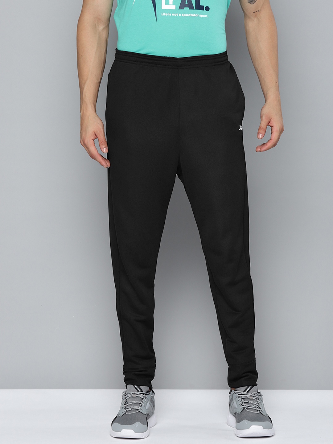 

Reebok Men Black Solid Speedwick Slim Fit Running Joggers